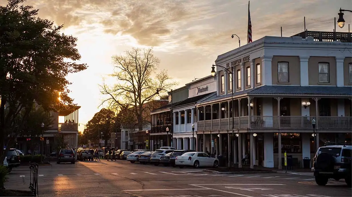 Oxford, Mississippi town square at dusk with the University of Mississippi campus in the background